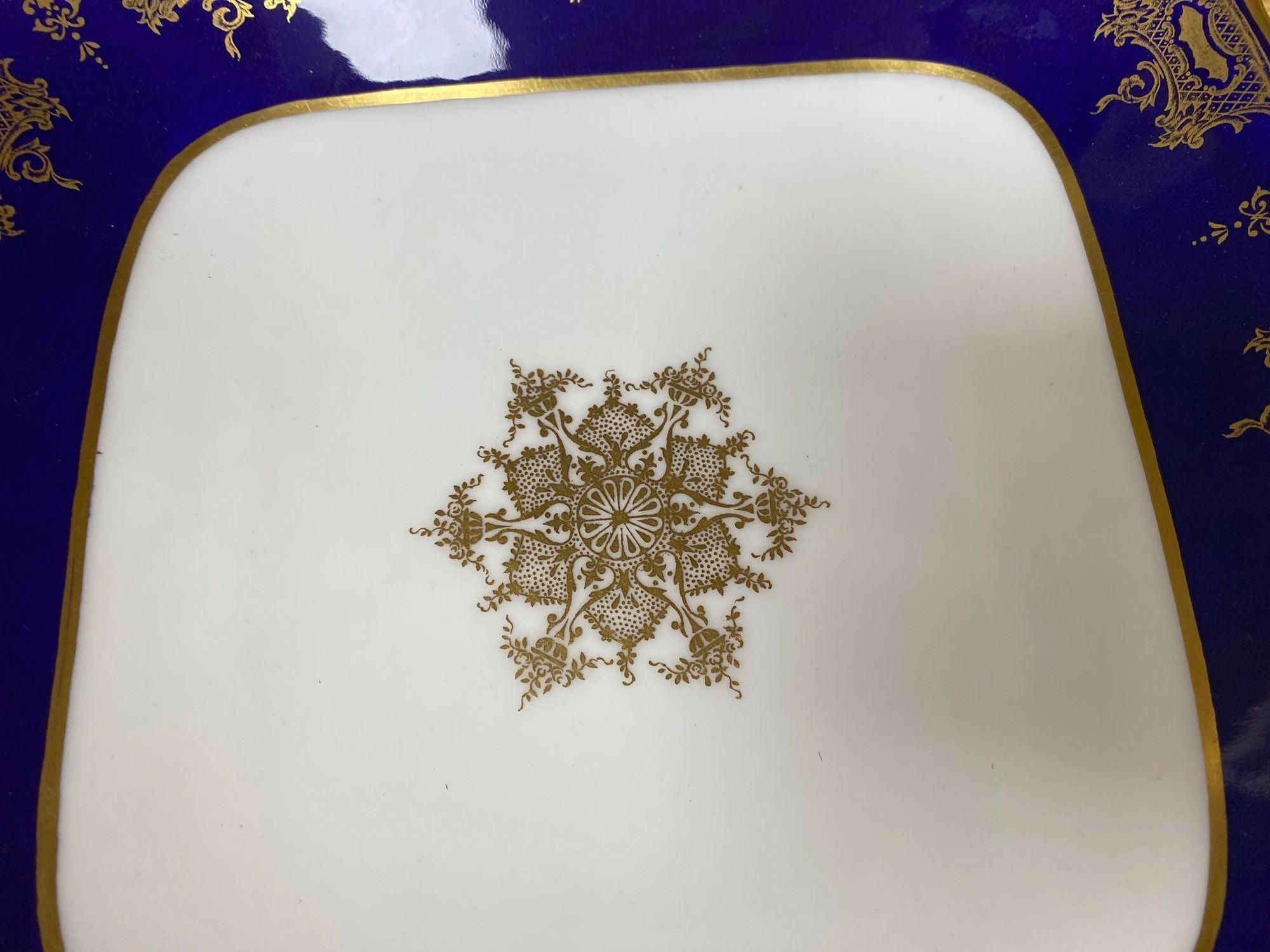 A Coalport bone china dessert service, pattern 8149 (18) and a Coalport two handled serving dish